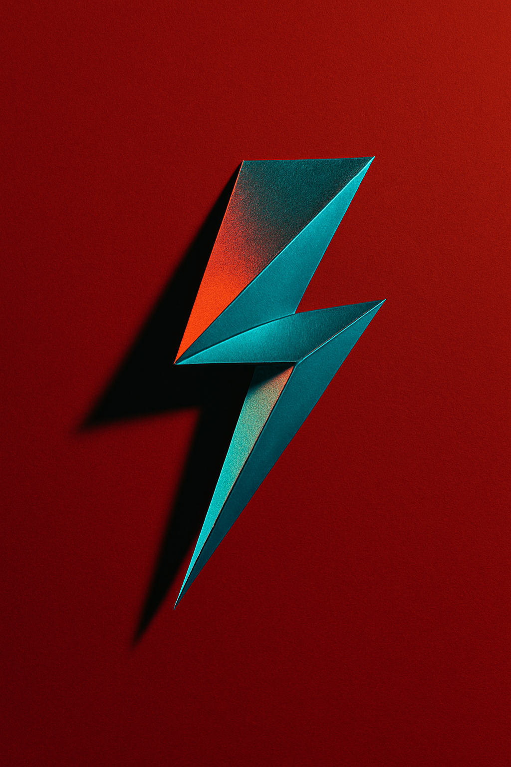 An abstract lightning bolt made from folded metallic paper, placed on a deep red ...