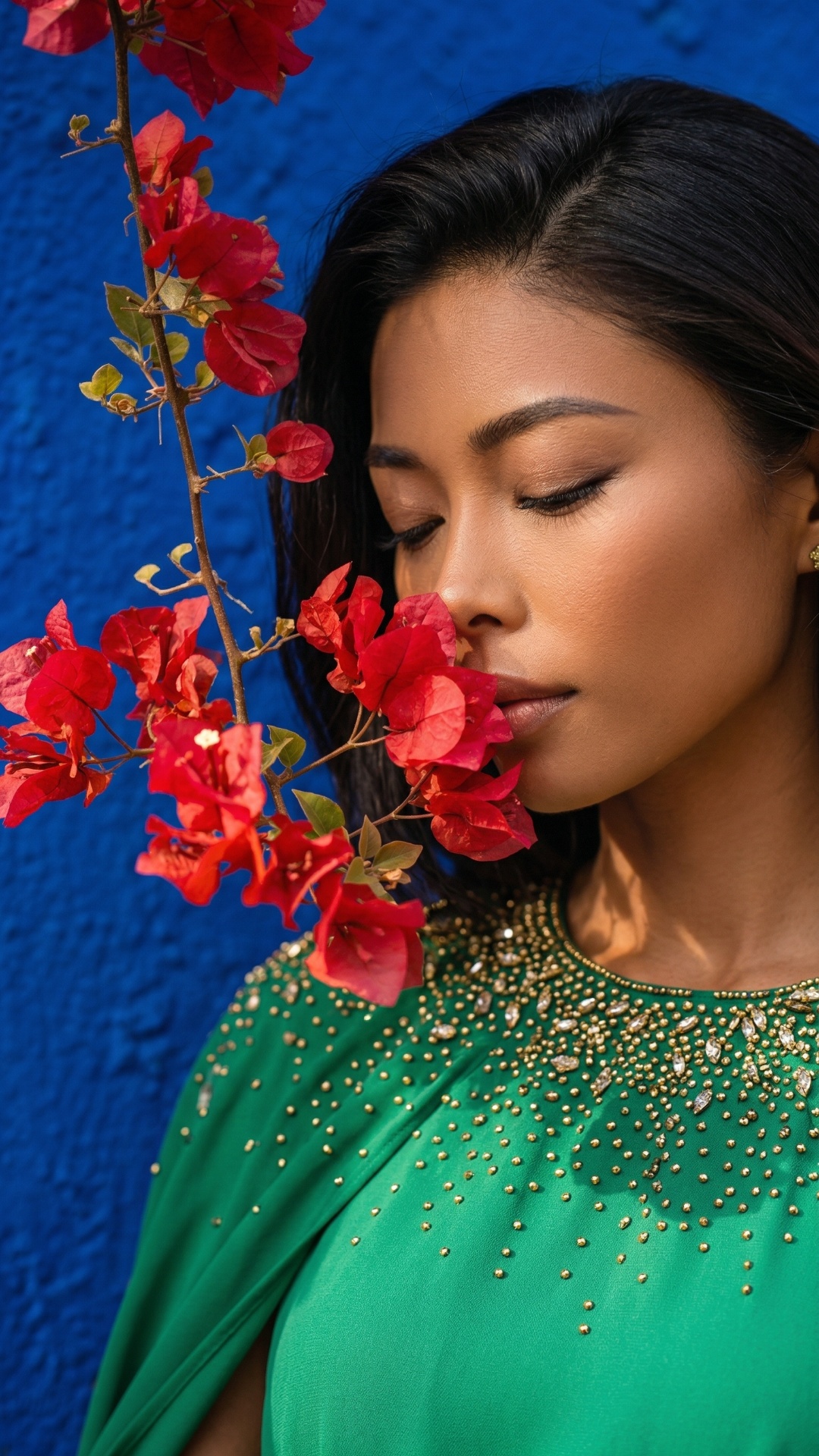she is smelling flowers