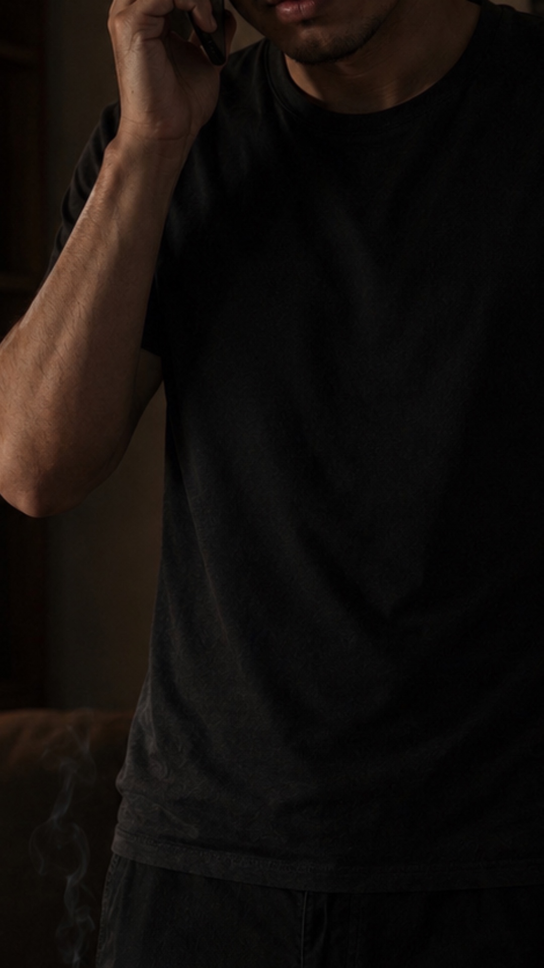Use the image as first frame. Realistic vertical 9:16 video.

Arsen stands alone in a dark room, ...