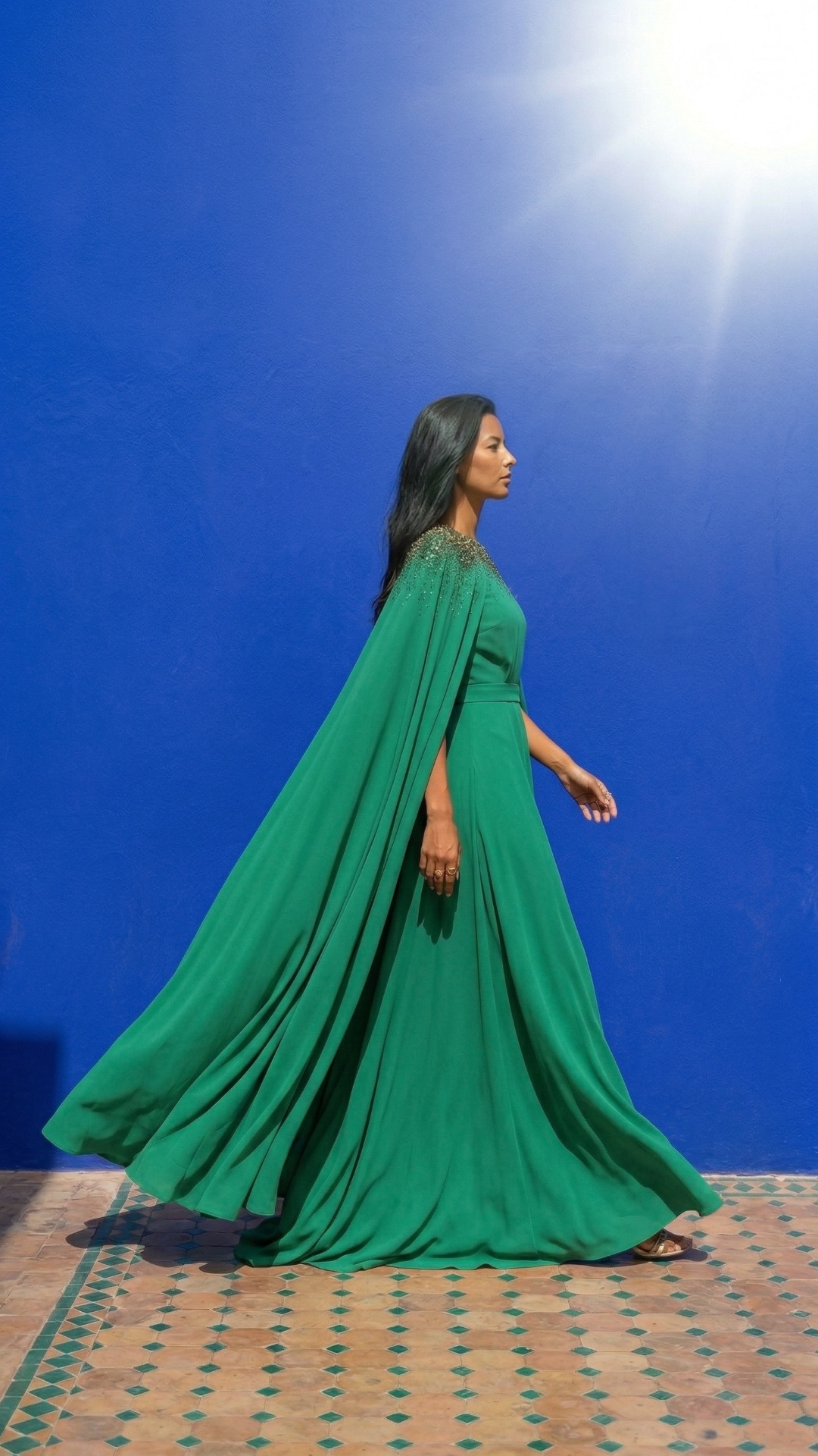she is walking along the wall