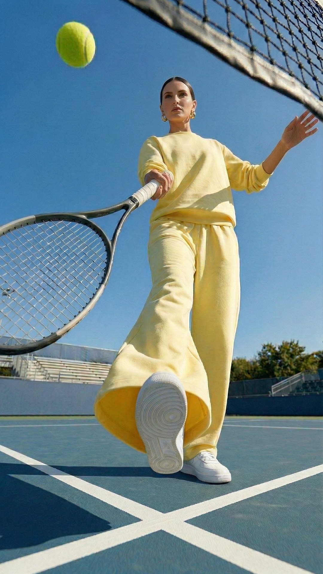 she is hitting a ball with her racket