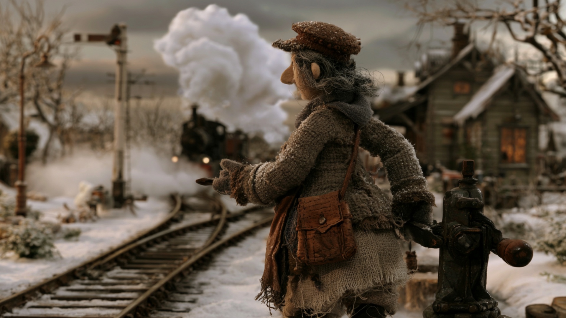 The railway worker keeps one hand on the existing switch handle and slowly pulls the heavy lever ...