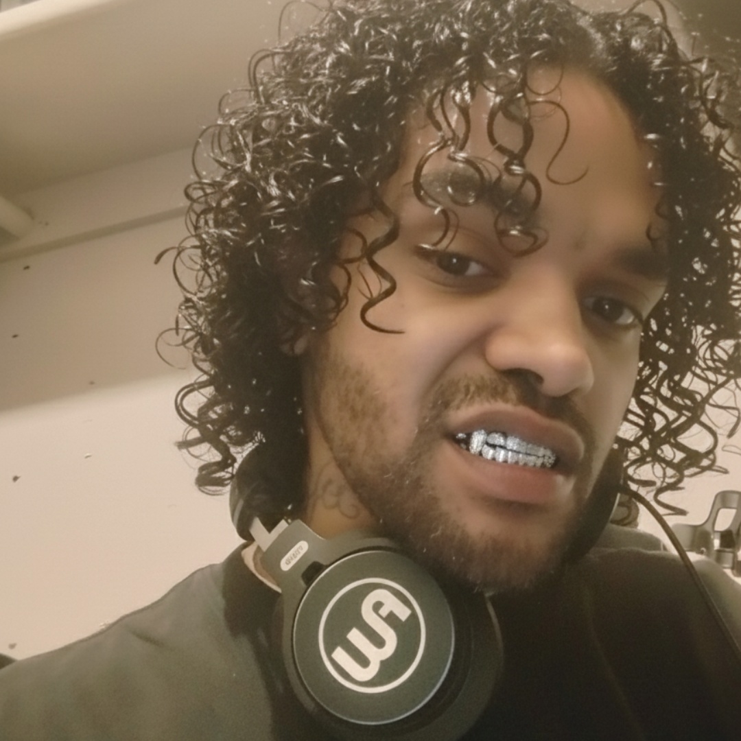 Head bobbing listening to rap music , eazy e music playing mouth movement , grillz in mouth shinning