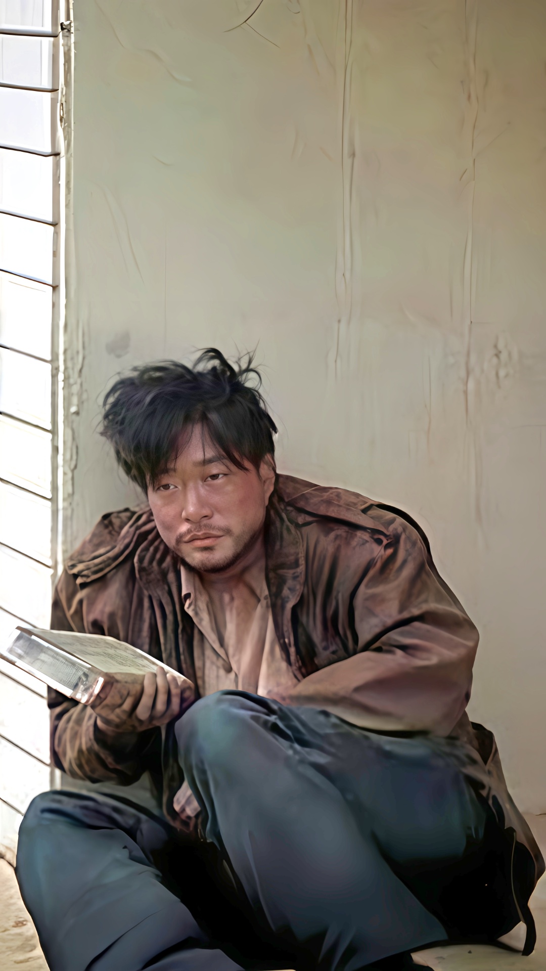 This scene takes place in a city somewhere in Korea.
A Korean man is sitting on a chair in a rela...