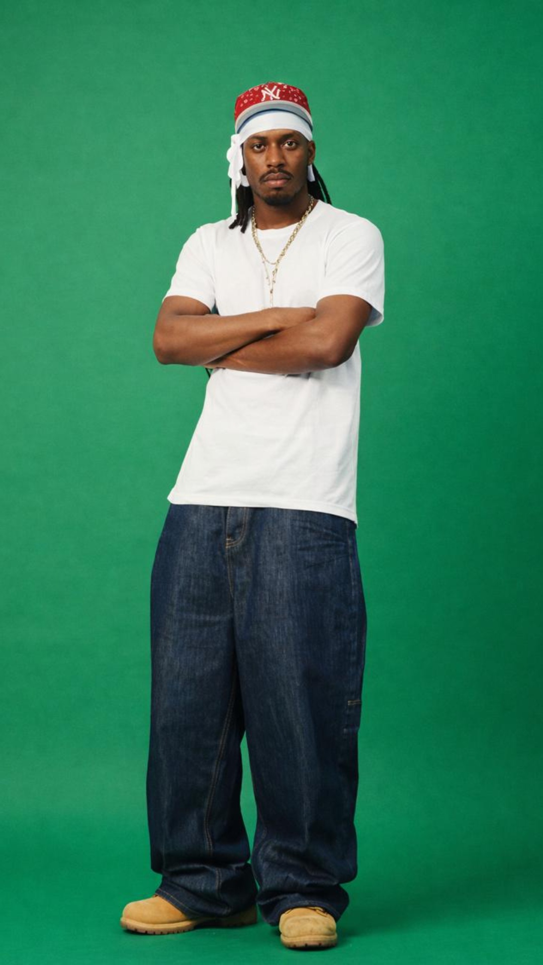 Single static full-body shot, 8 seconds. The man stands upright on a clean green screen backgroun...