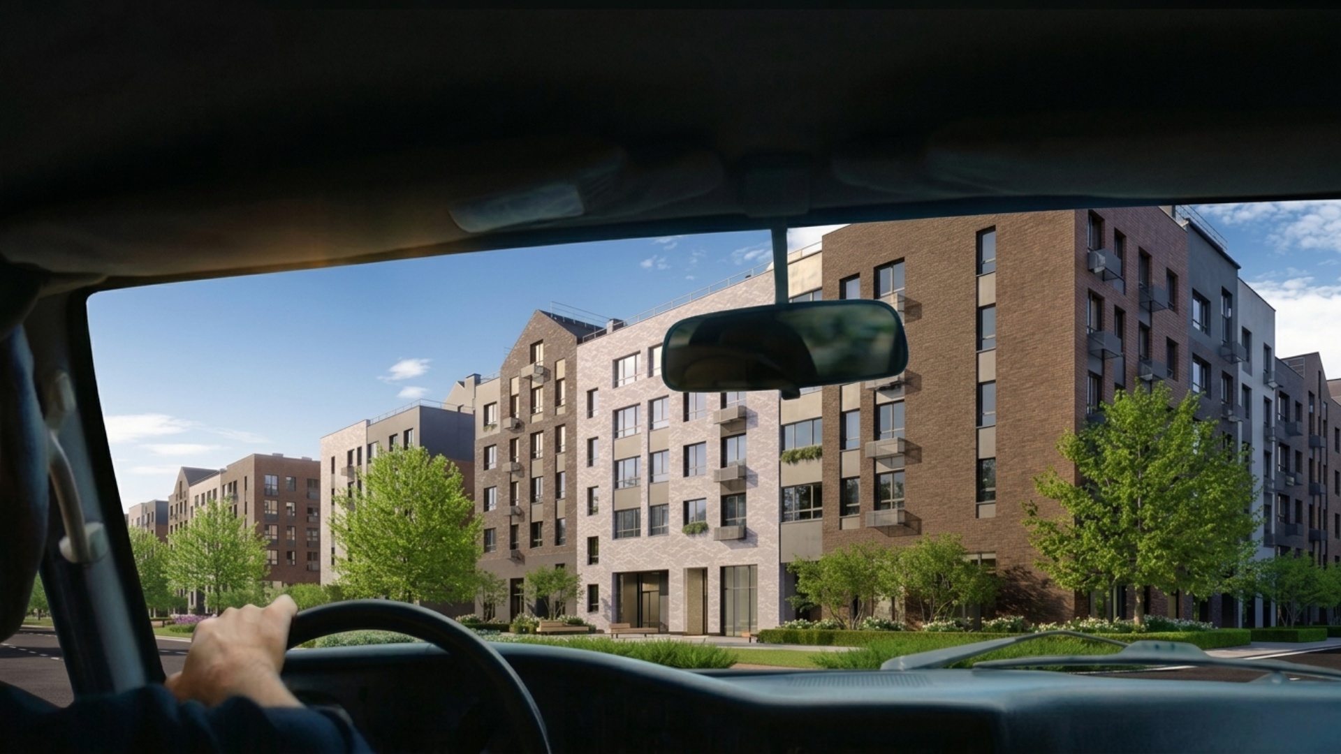 First-person POV from inside a moving car. The camera is positioned at driver eye level behind th...