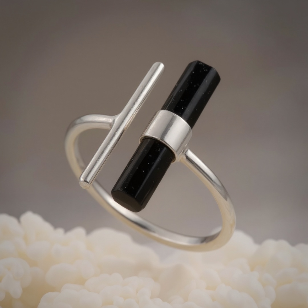 Cinematic product video of a luxury ring. The ring is suspended in mid-air, slowly rotating and s...