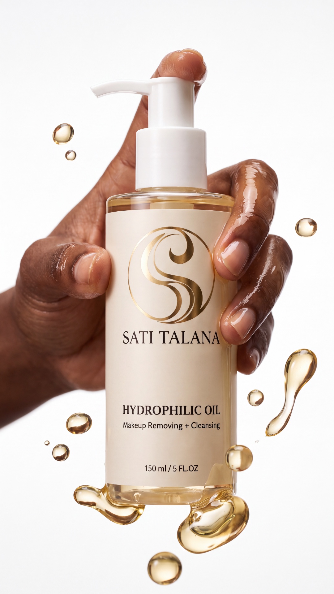 Camera slowly dollies backward, revealing the SATI TALANA bottle and glossy golden oil droplets. ...