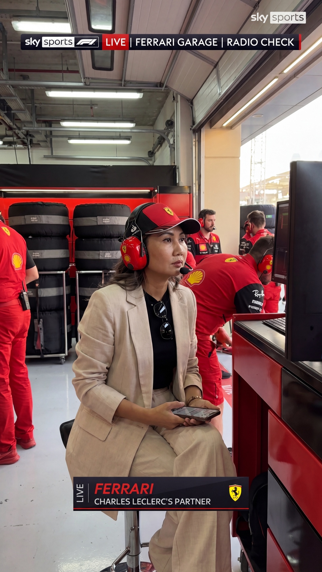 Create an ultra realistic Formula 1 live broadcast “radio check” moment inside the Ferrari garage...