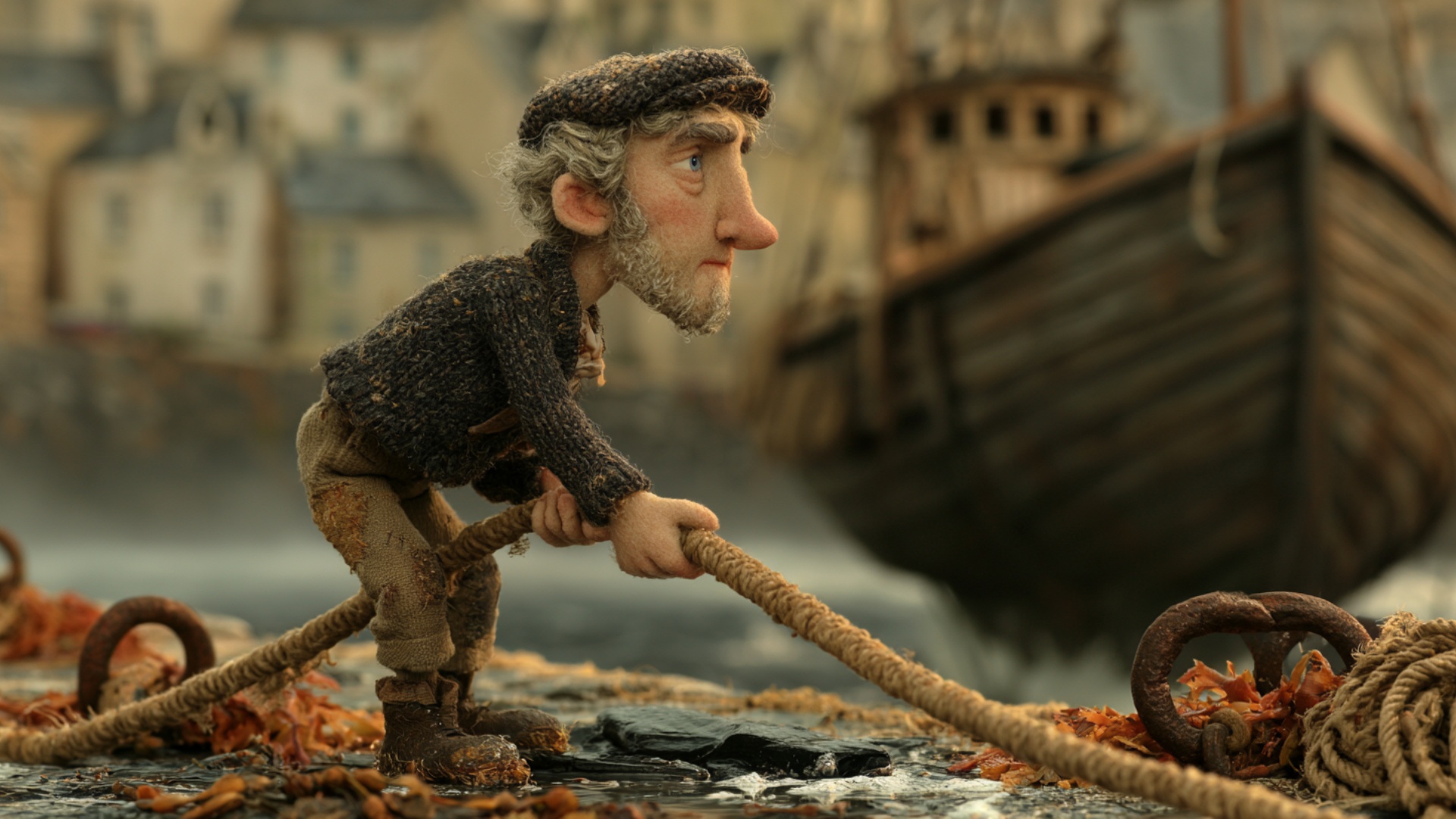 The fisherman plants his feet firmly on the wet stones and pulls the thick mooring rope toward hi...