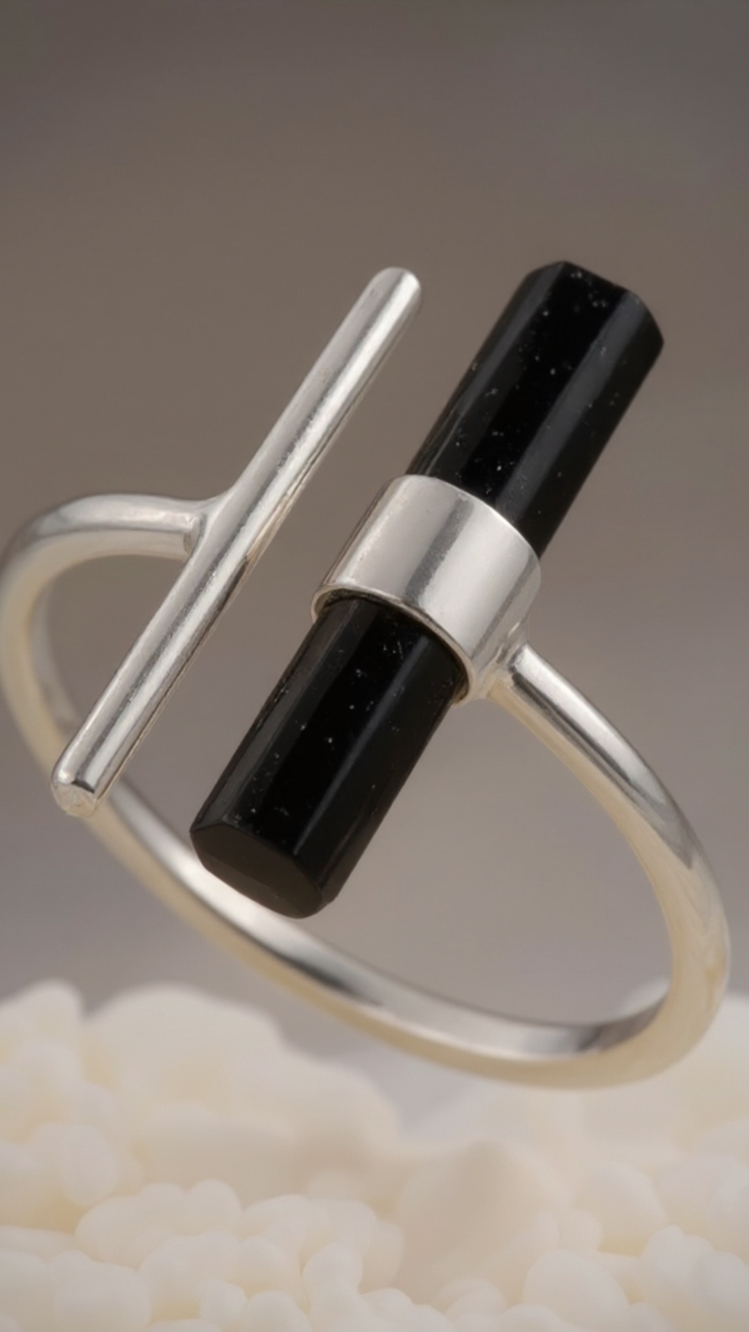 Cinematic product video of the reference ring. The ring is suspended in mid-air, slowly rotating ...