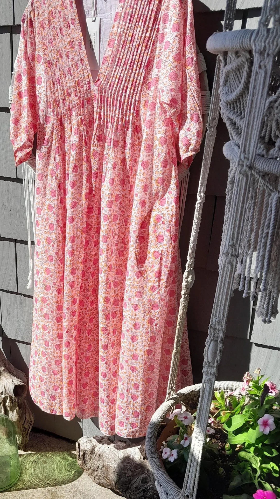 make the dress blow gently in the wind. zoom in on chest area too.