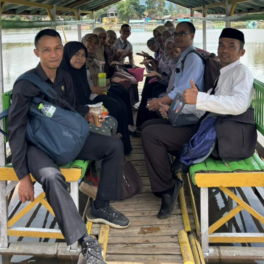 A cinematic transformation of a group of real Indonesian teachers sitting together on a wooden ba...