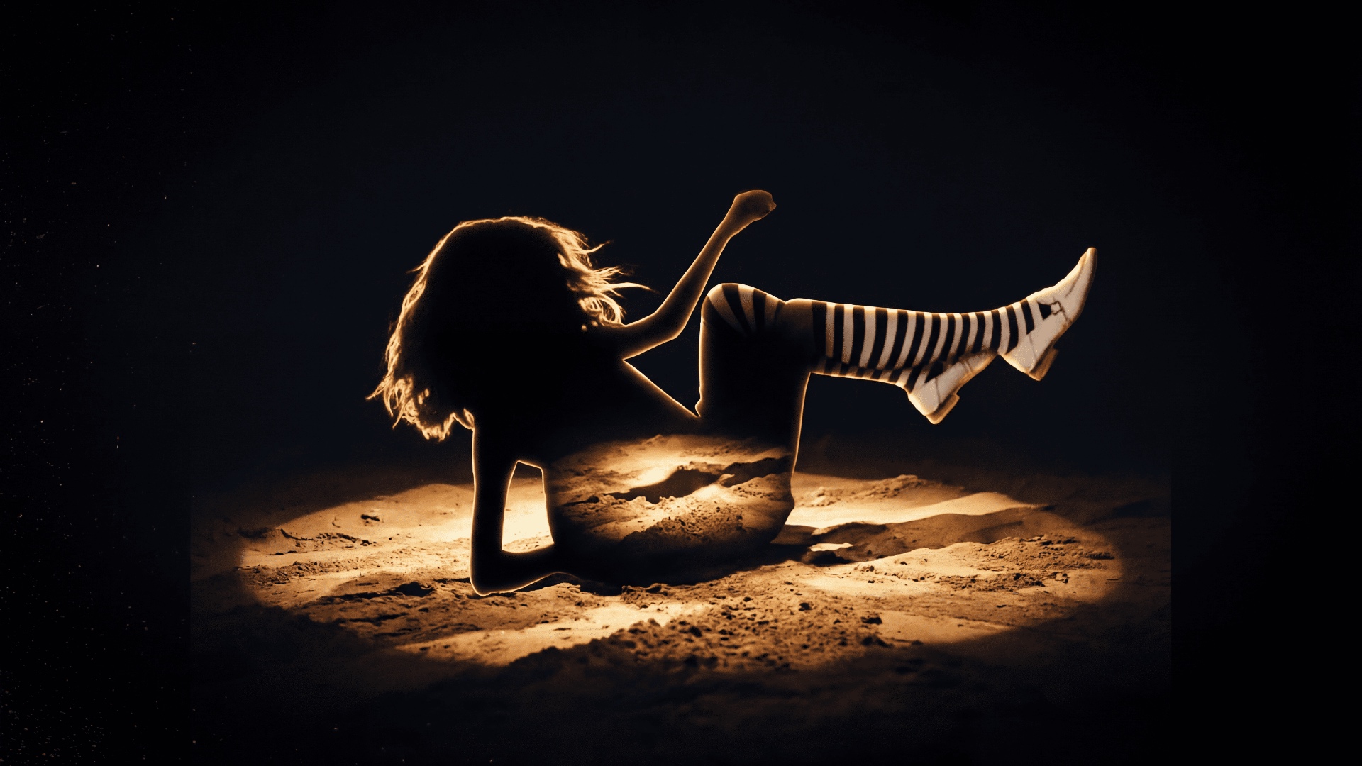Animate: the silhouetted girl falls straight down in slow motion, preserving the silhouette shape...