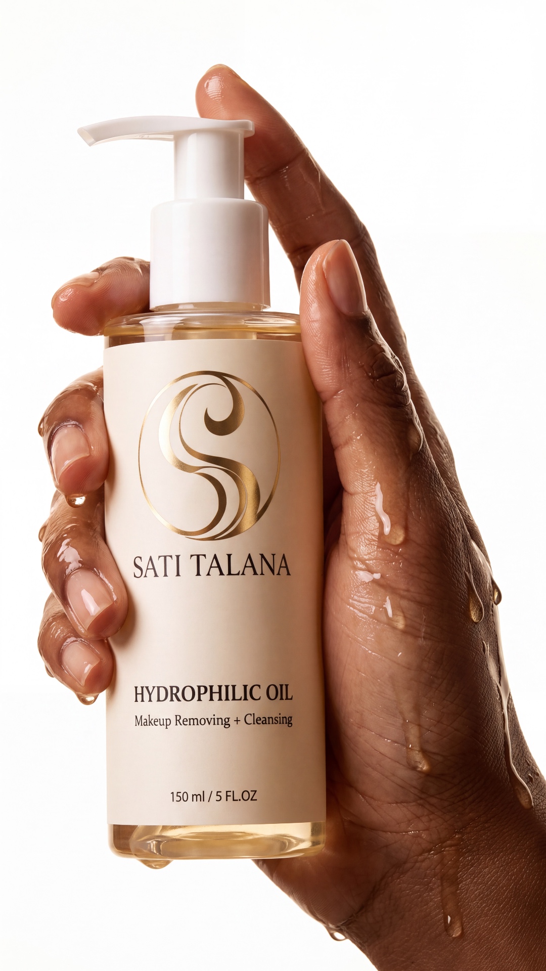 Golden oil slowly drips from the fingertip. Subtle hand movement, glossy liquid, macro beauty sho...