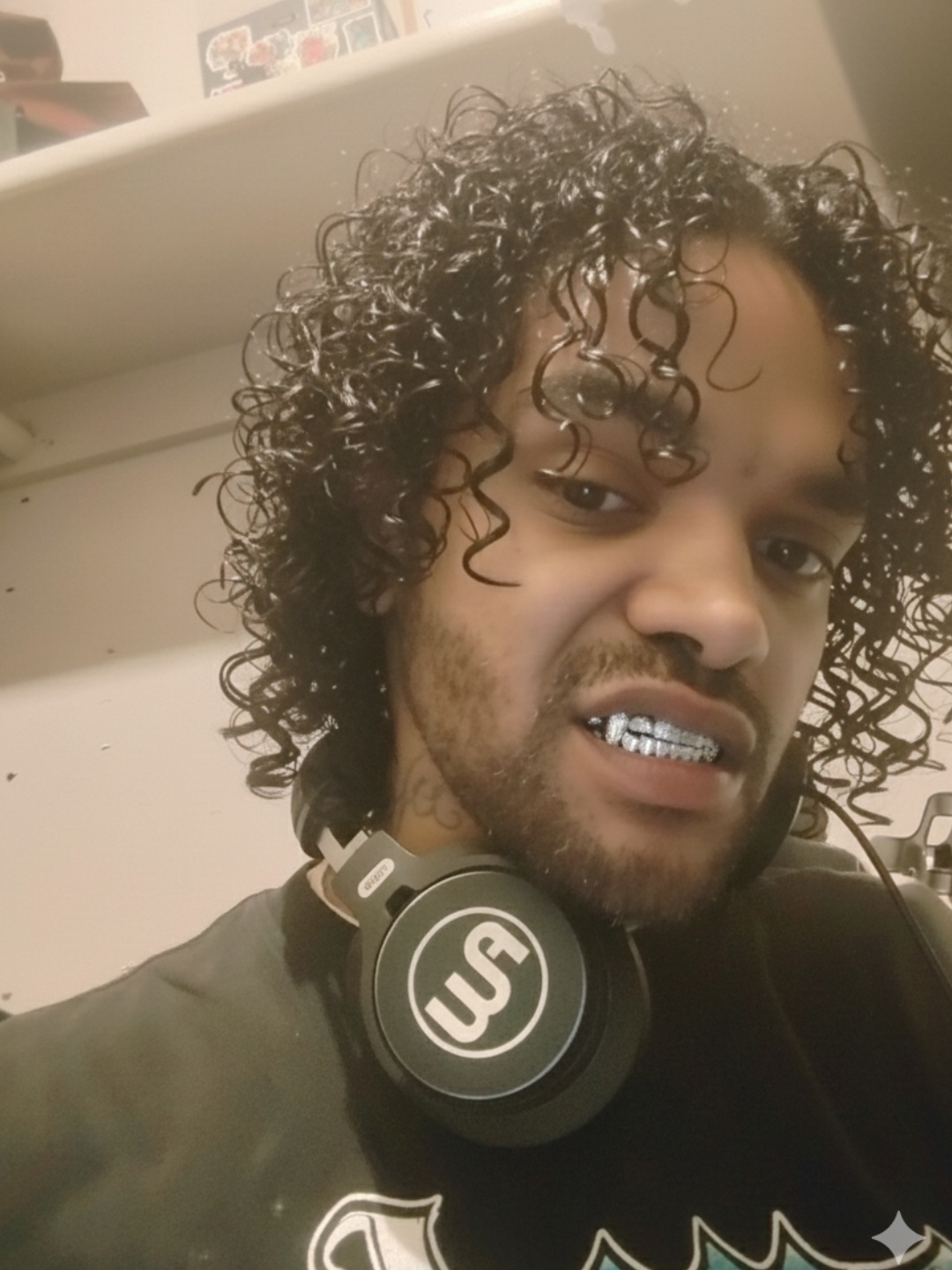 Talking to the camera , Grillz shinning in mouth glissening