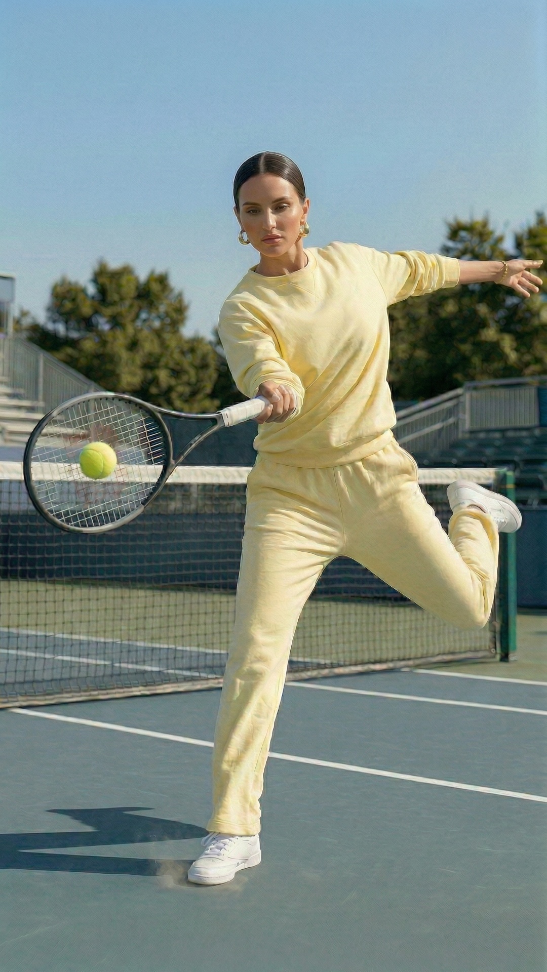 she hits a ball with her racket