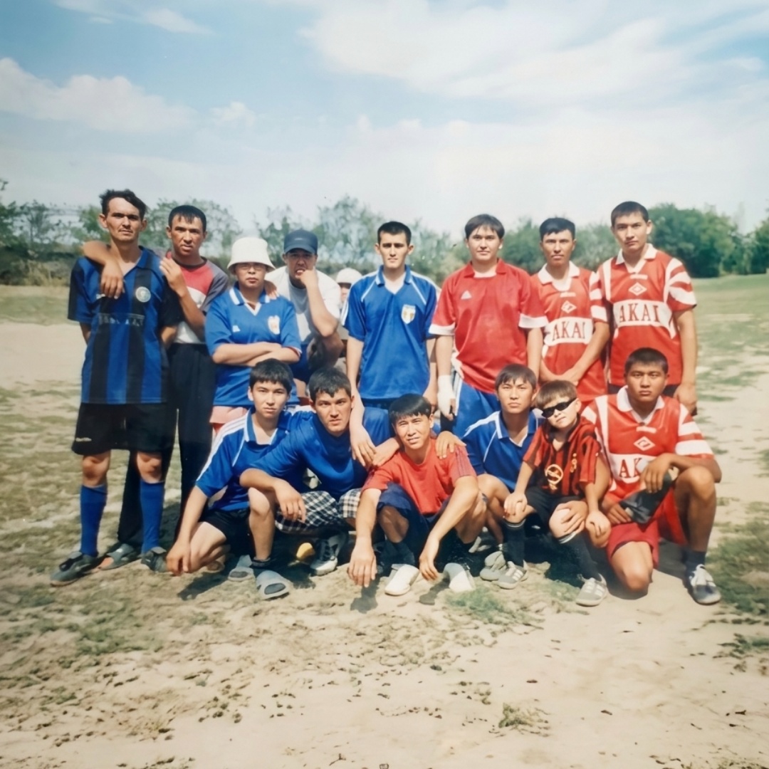 Animate this group photo naturally while preserving the exact appearance and identity of all 14 f...