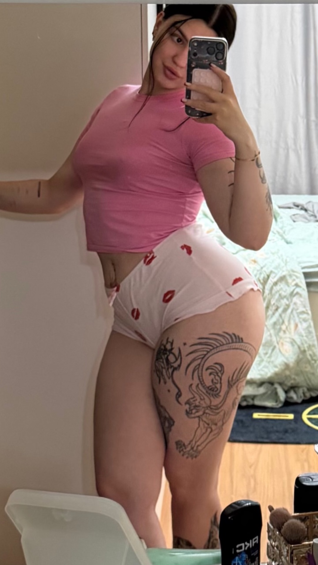 cinematic giantess transformation video, a confident young woman in a pink fitted t-shirt and sof...