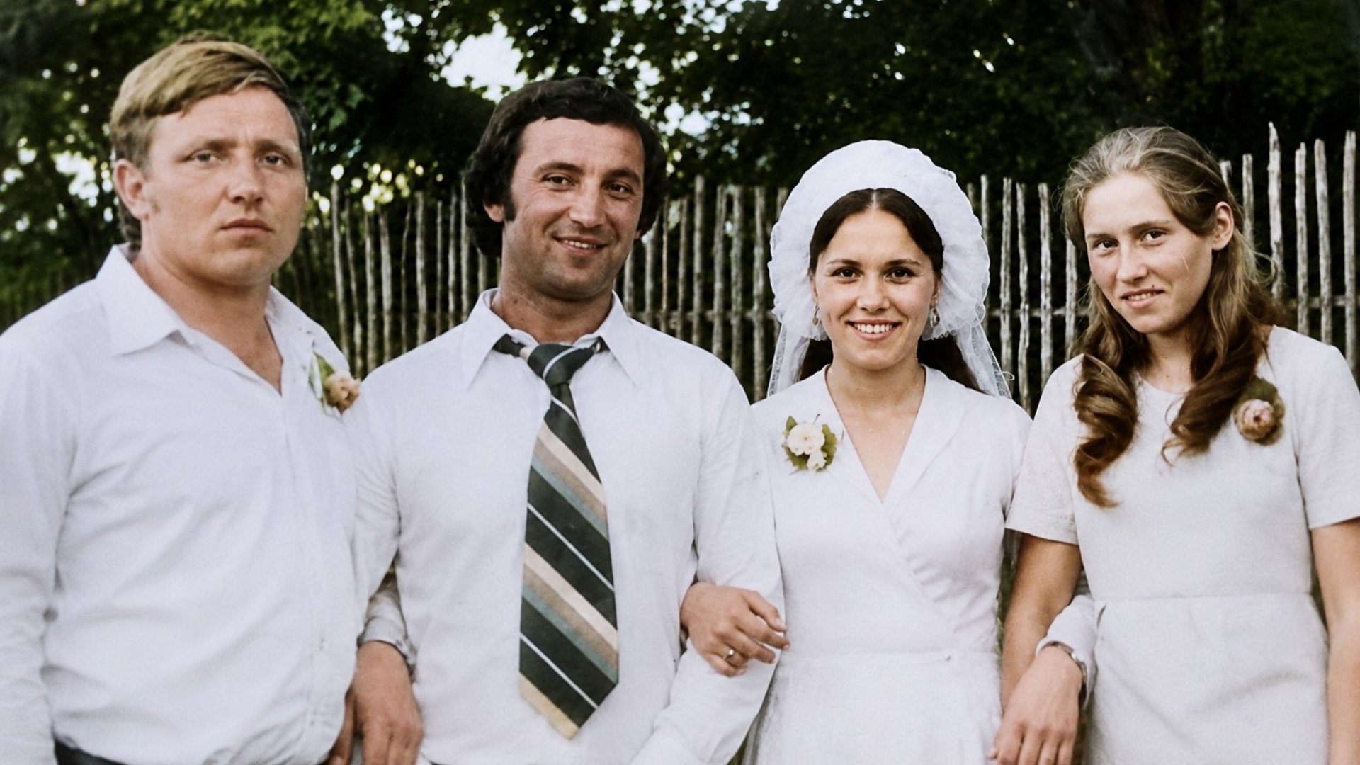 Vintage wedding photograph gently comes to life. The bride and groom exchange warm smiles and bri...