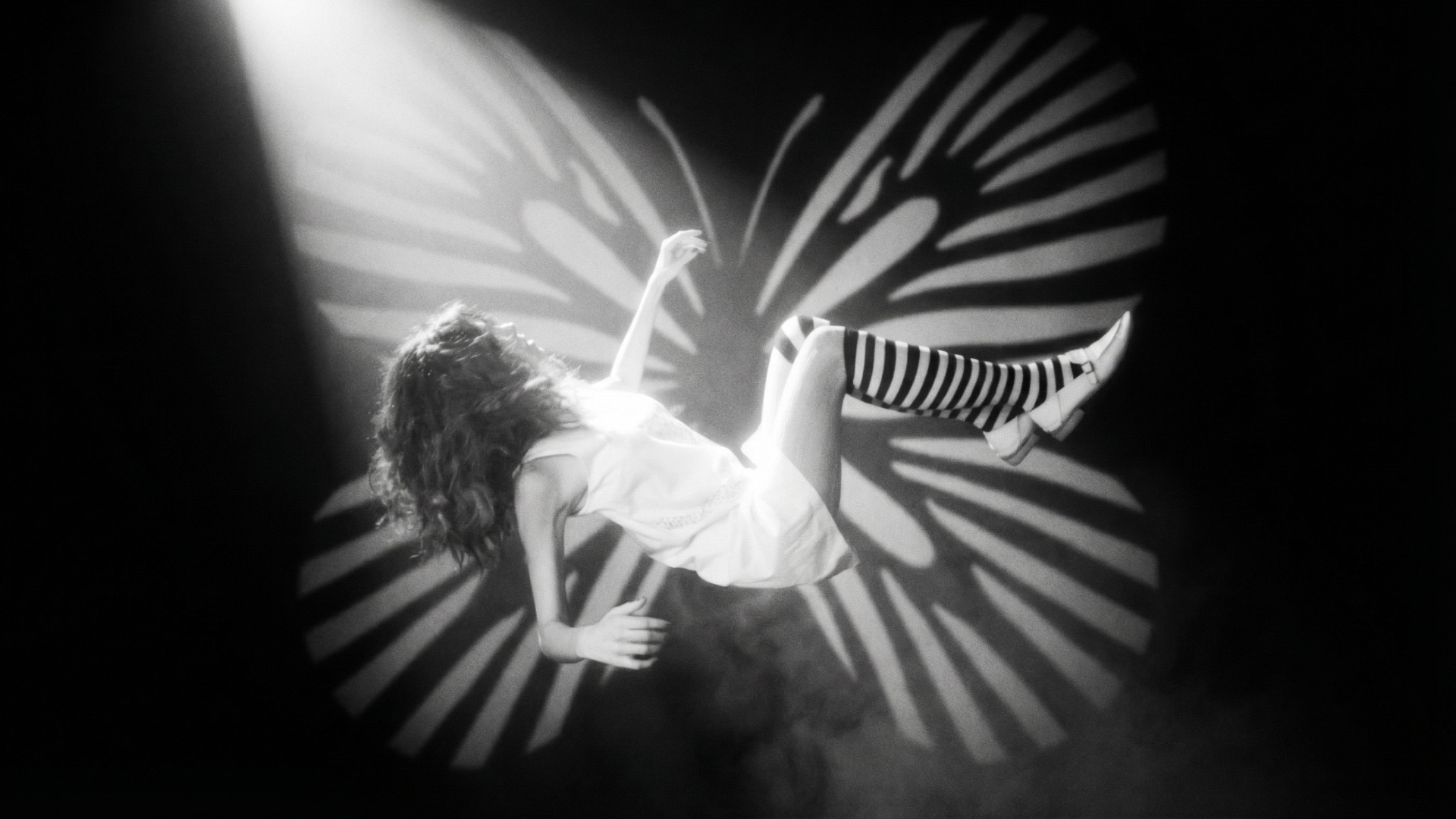 Animate: the girl falls downward in slow motion, keeping her pose; add a tiny sway left-right and...