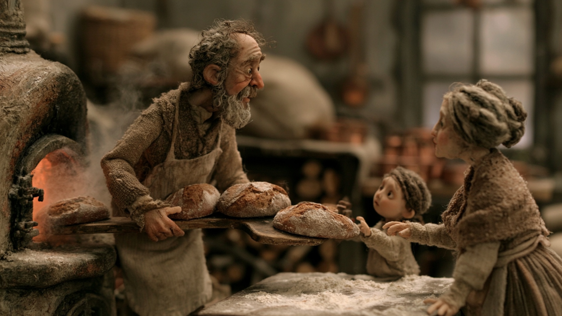 The baker steadily pulls the heavy wooden bread board farther away from the glowing oven during t...